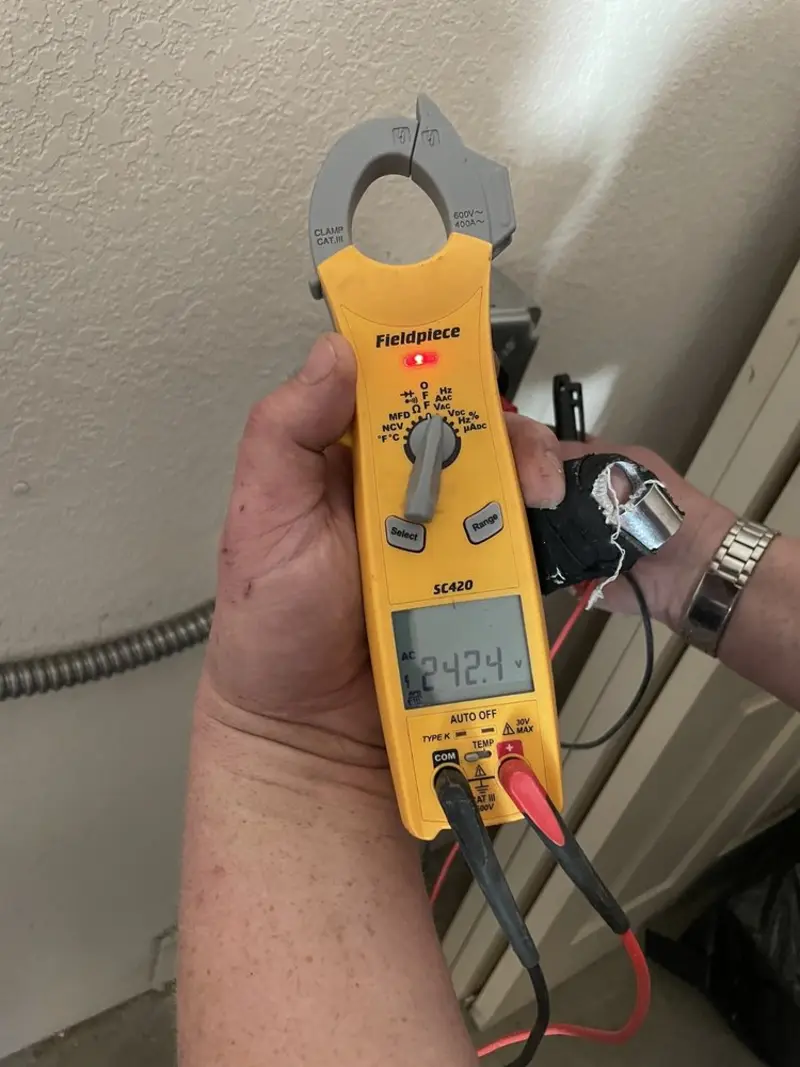 Voltage testing with clamp meter during Electrical Installation Services in Rathdrum